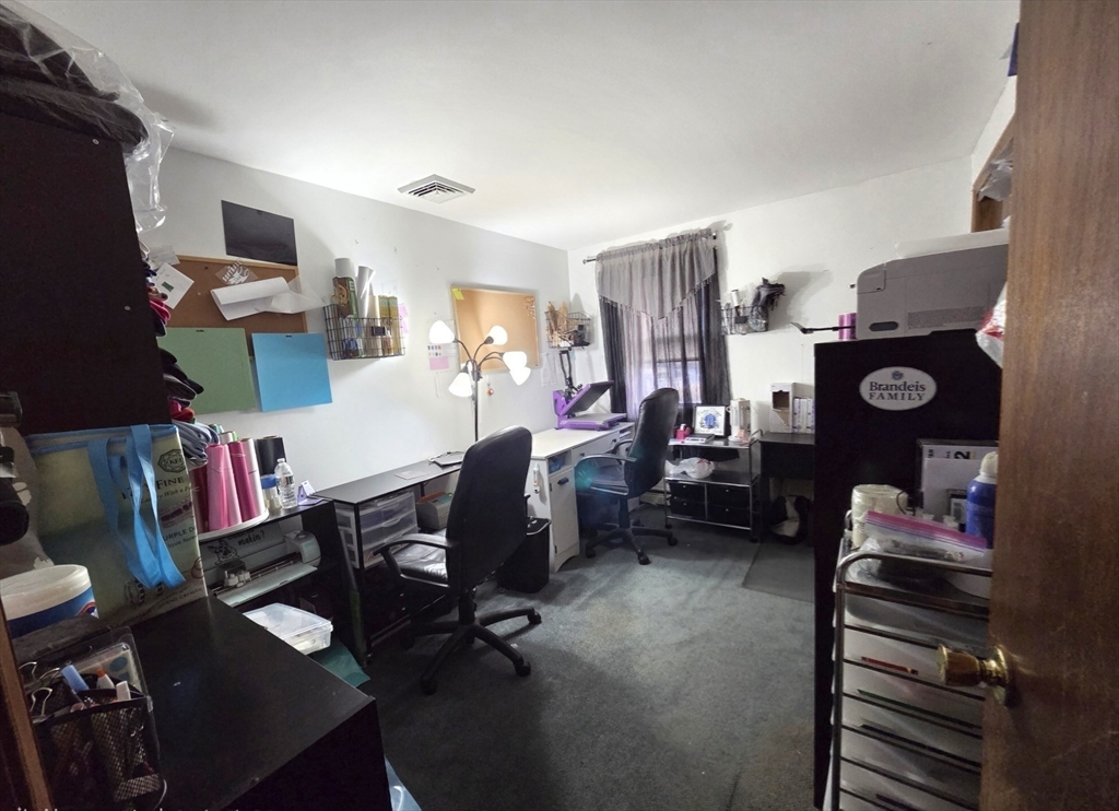 43 Emily Jeffers Road, Unit 43 Randolph, MA 02368 - Photo 22 of 31 a room with furniture a rug toys and a window