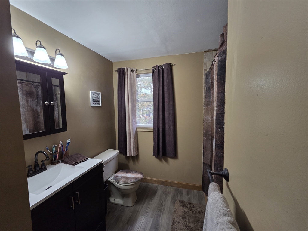 43 Emily Jeffers Road, Unit 43 Randolph, MA 02368 - Photo 27 of 31 a bathroom with a double vanity sink toilet and mirror