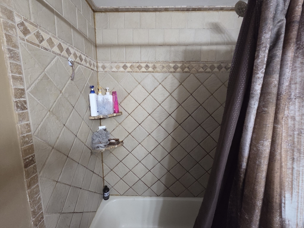 43 Emily Jeffers Road, Unit 43 Randolph, MA 02368 - Photo 28 of 31 a bathroom with a shower