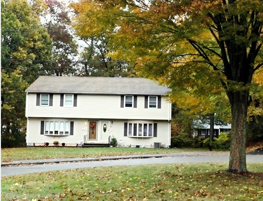 43 Emily Jeffers Road, Unit 43 Randolph, MA 02368 - Photo 3 of 31 front view of a house with a yard