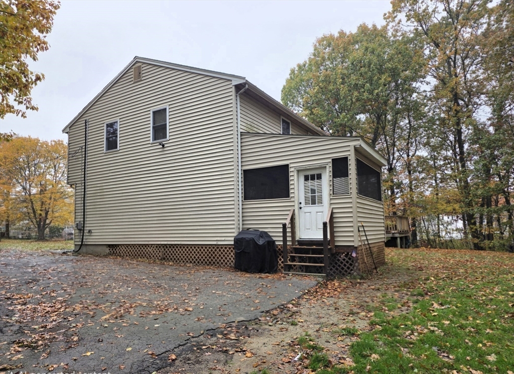 43 Emily Jeffers Road, Unit 43 Randolph, MA 02368 - Photo 5 of 31 a view of a house with a yard