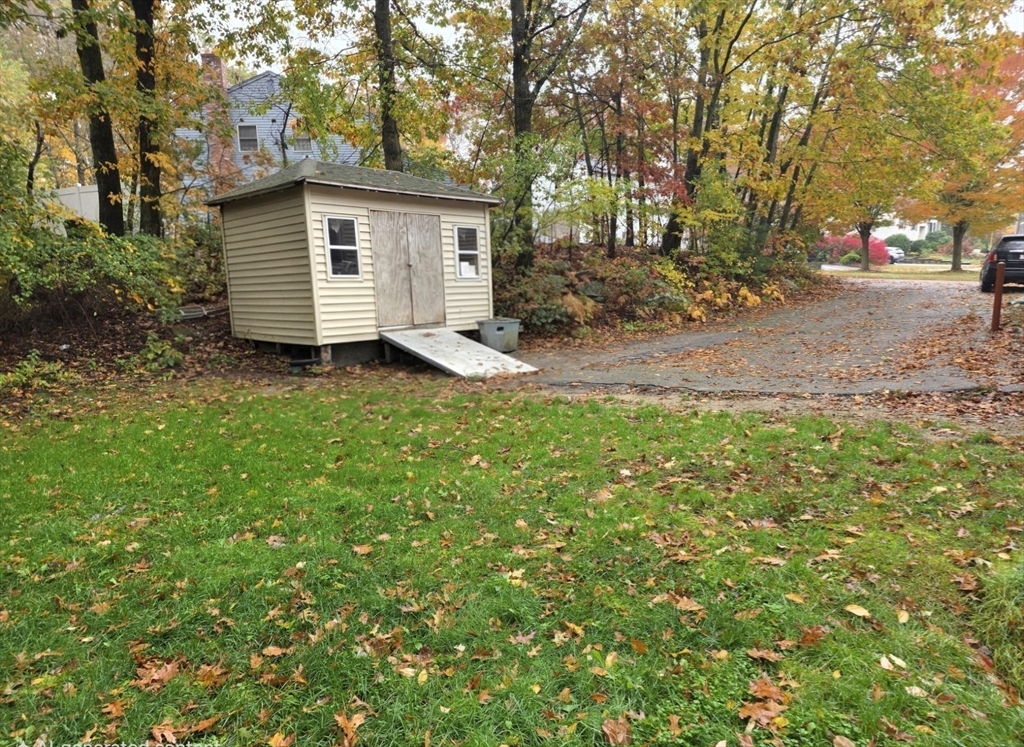 43 Emily Jeffers Road, Unit 43 Randolph, MA 02368 - Photo 6 of 31 a view of a backyard with large trees