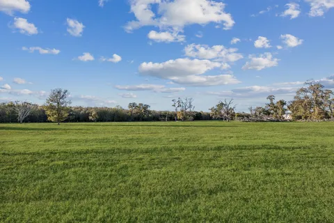 a view of a golf course with a lake
