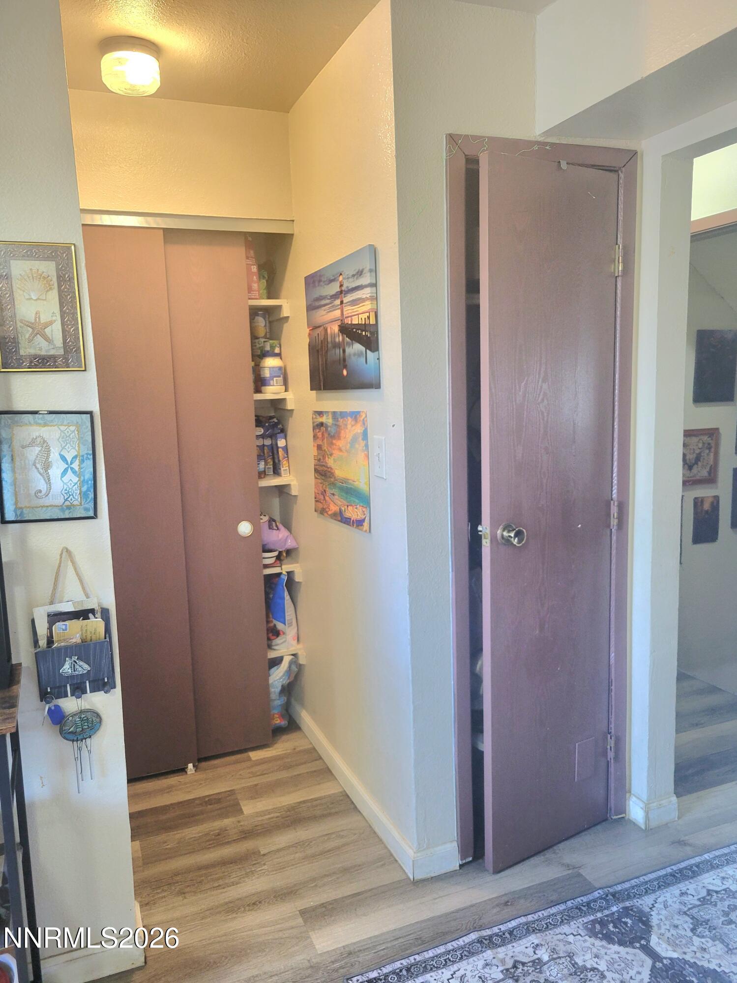 1404 East 9th Street, Unit 3 Reno, NV 89512 - Photo 11 of 29 a view of a hallway with wooden floor and closet