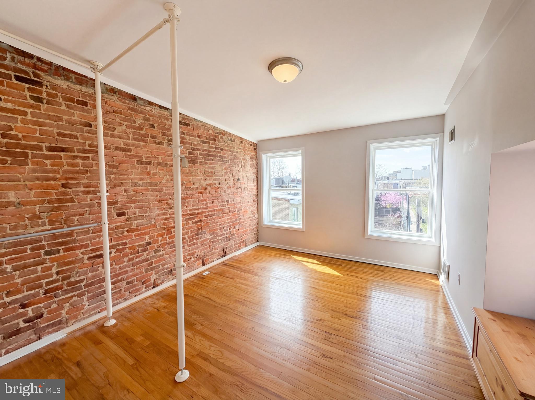 724 13th Street Northeast Washington, DC 20002 - Photo 12 of 20 Sunlit space with exposed brick charm.