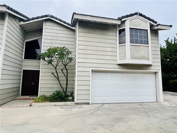 a front view of a house with a garage