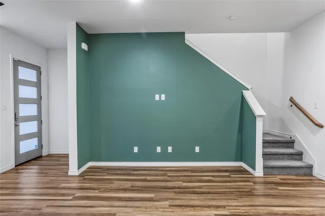 a view of a livingroom with wooden floor