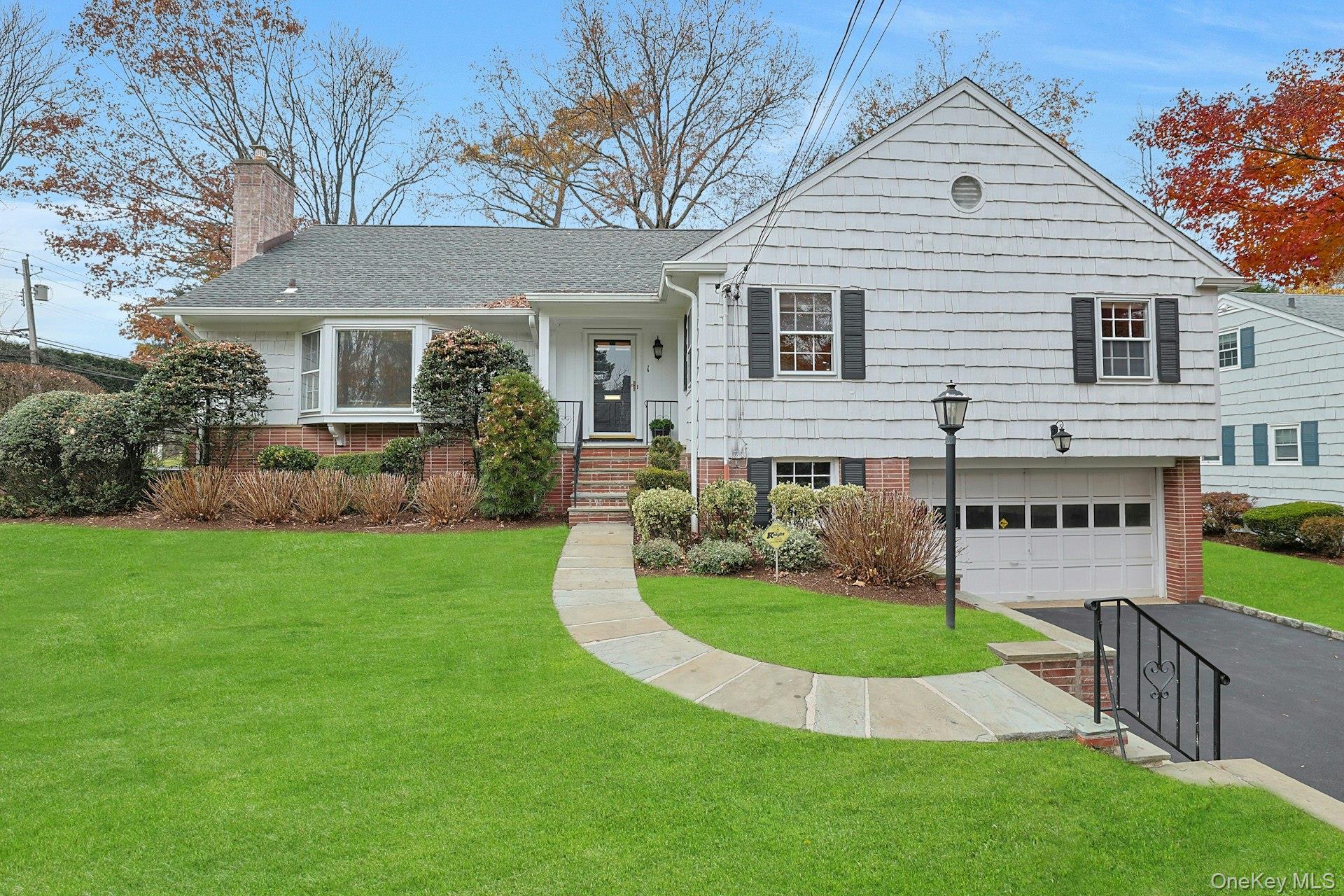 a view of a house with a backyard