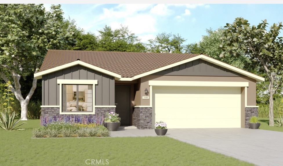 a front view of a house with garden