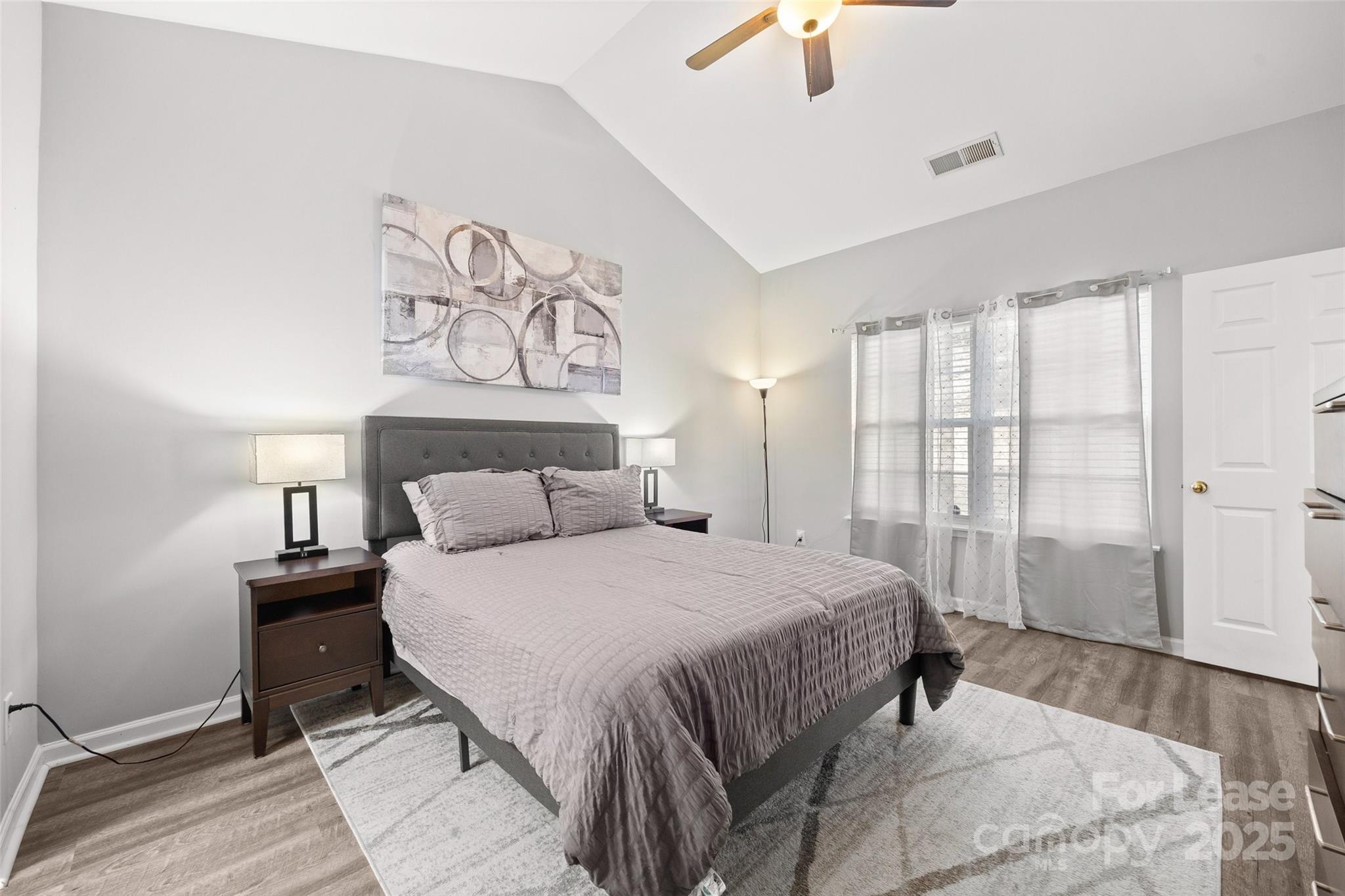 16865 Timber Crossing Road Charlotte, NC 28213 - Photo 14 of 39 a bedroom with a bed and a painting on the wall