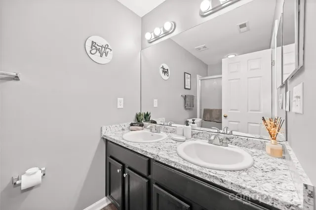 a bathroom with a tub and shower