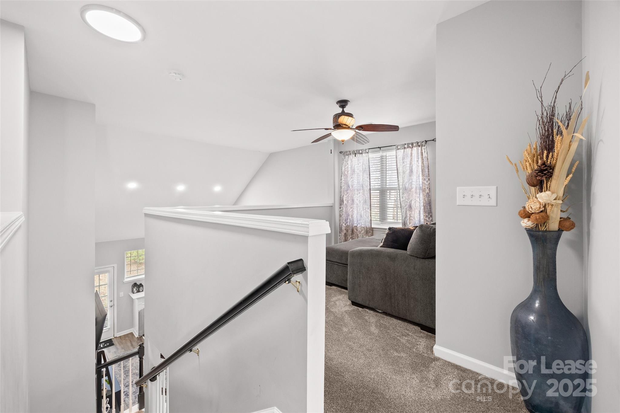 16865 Timber Crossing Road Charlotte, NC 28213 - Photo 19 of 39 a living room with furniture and a chandelier