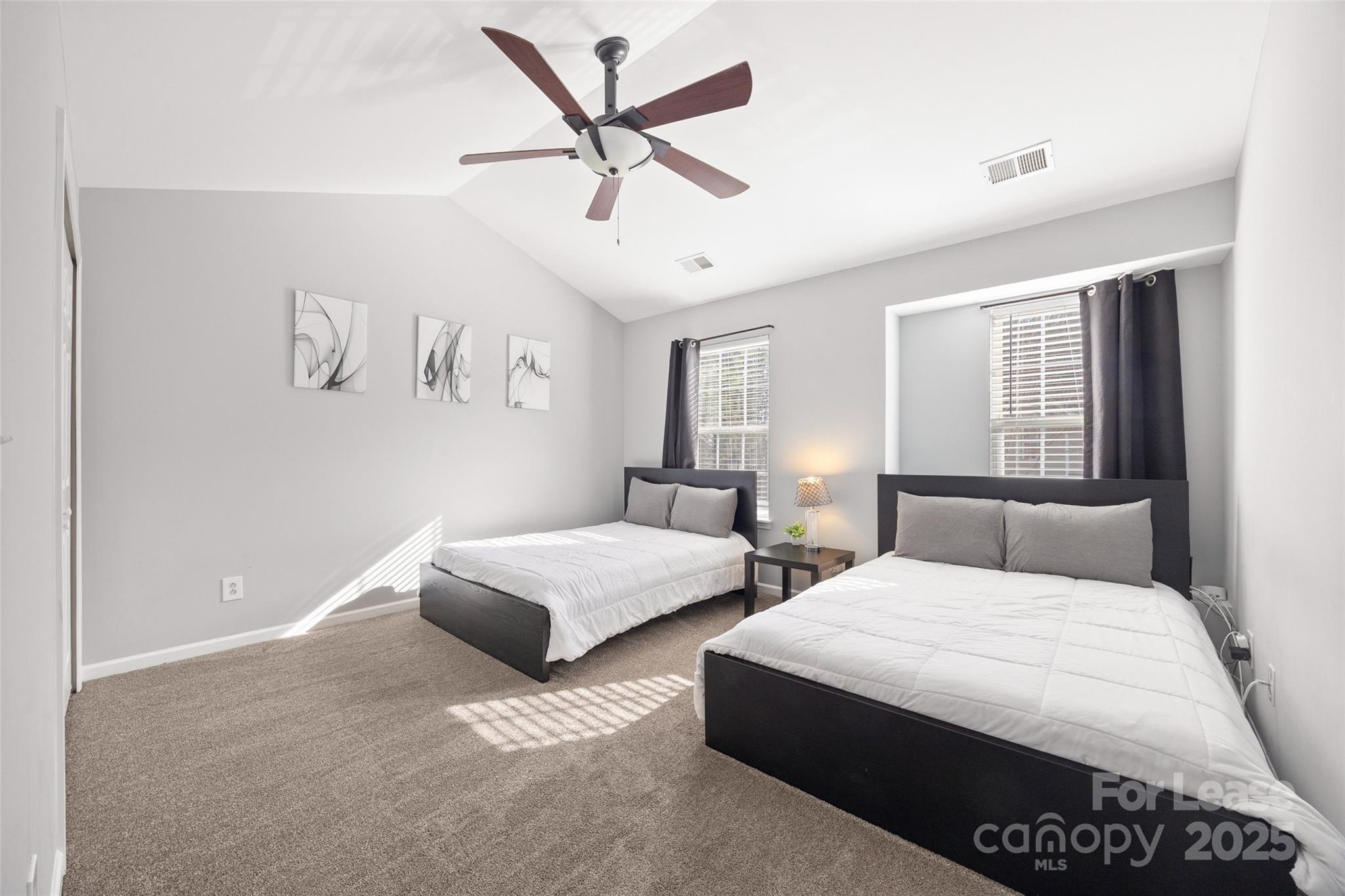 16865 Timber Crossing Road Charlotte, NC 28213 - Photo 21 of 39 a bedroom with two beds and ceiling fan