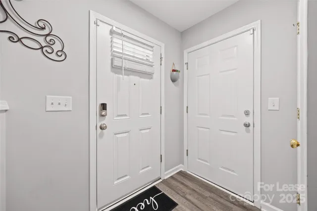 a kitchen with a sink appliances and cabinets