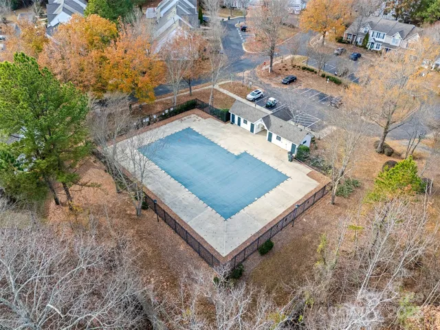 a view of front door of house and yard with green space