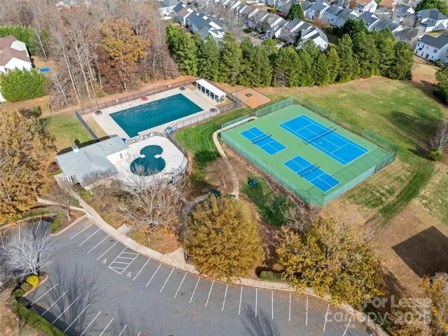 a view of a table and chairs under an umbrella