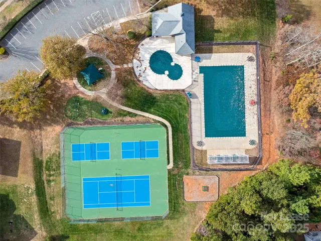 a view of an outdoor space and basketball court