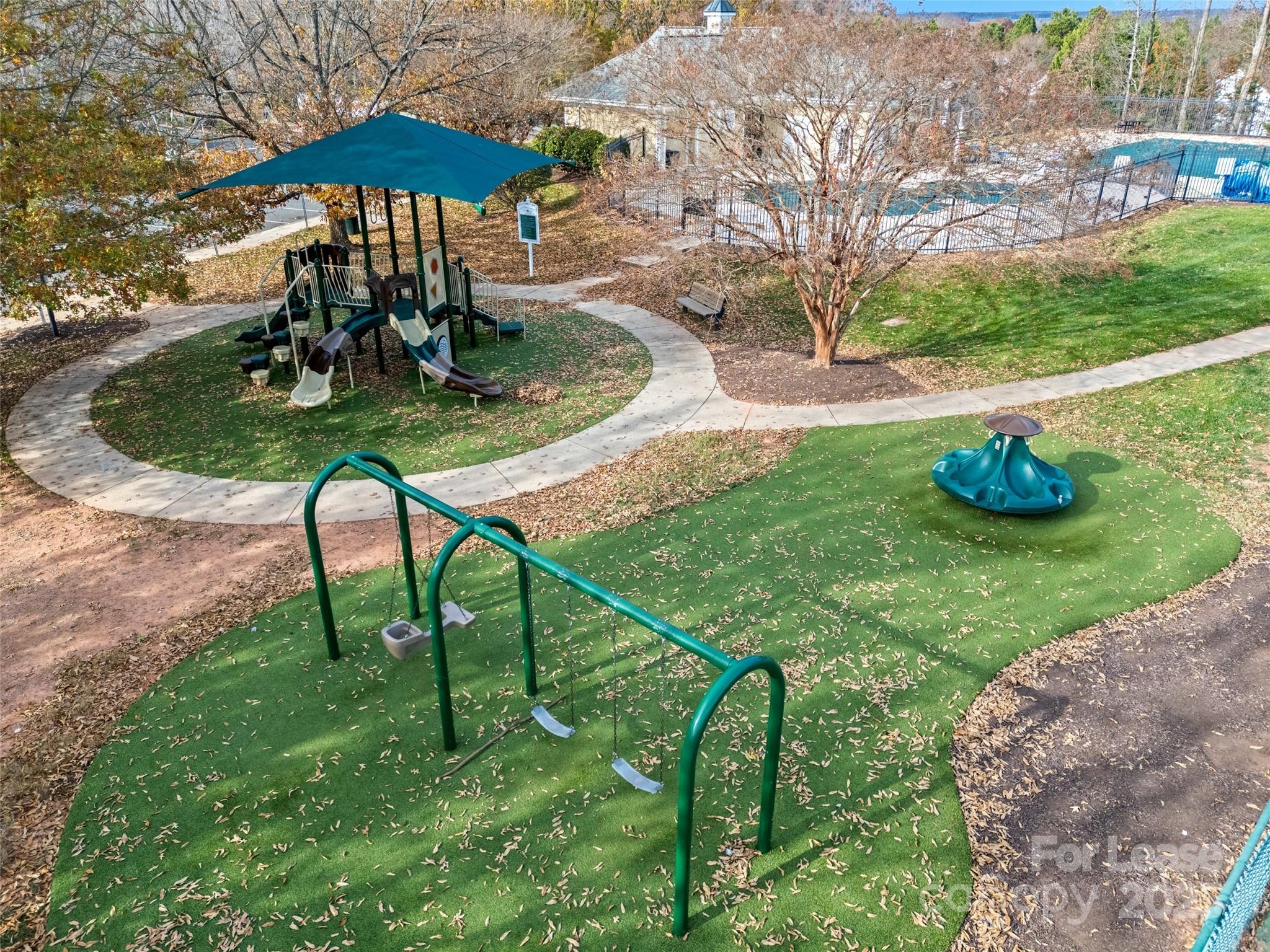 16865 Timber Crossing Road Charlotte, NC 28213 - Photo 36 of 39 a view of a table and chairs under an umbrella