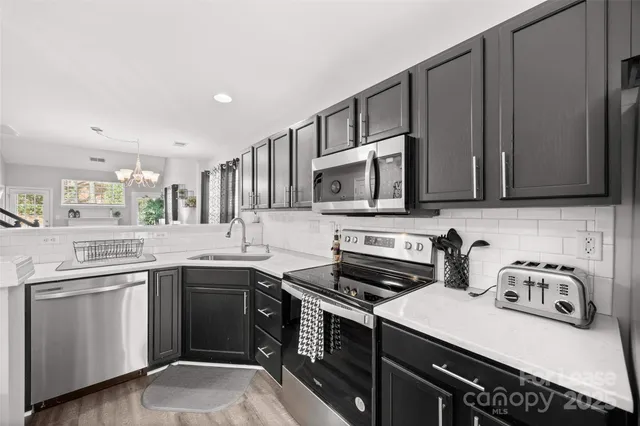 a view of a sink a faucet a faucet and window in the kitchen