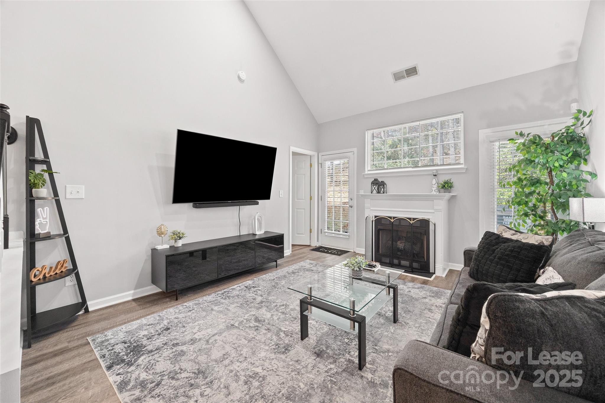 16865 Timber Crossing Road Charlotte, NC 28213 - Photo 10 of 39 a living room with furniture and a flat screen tv