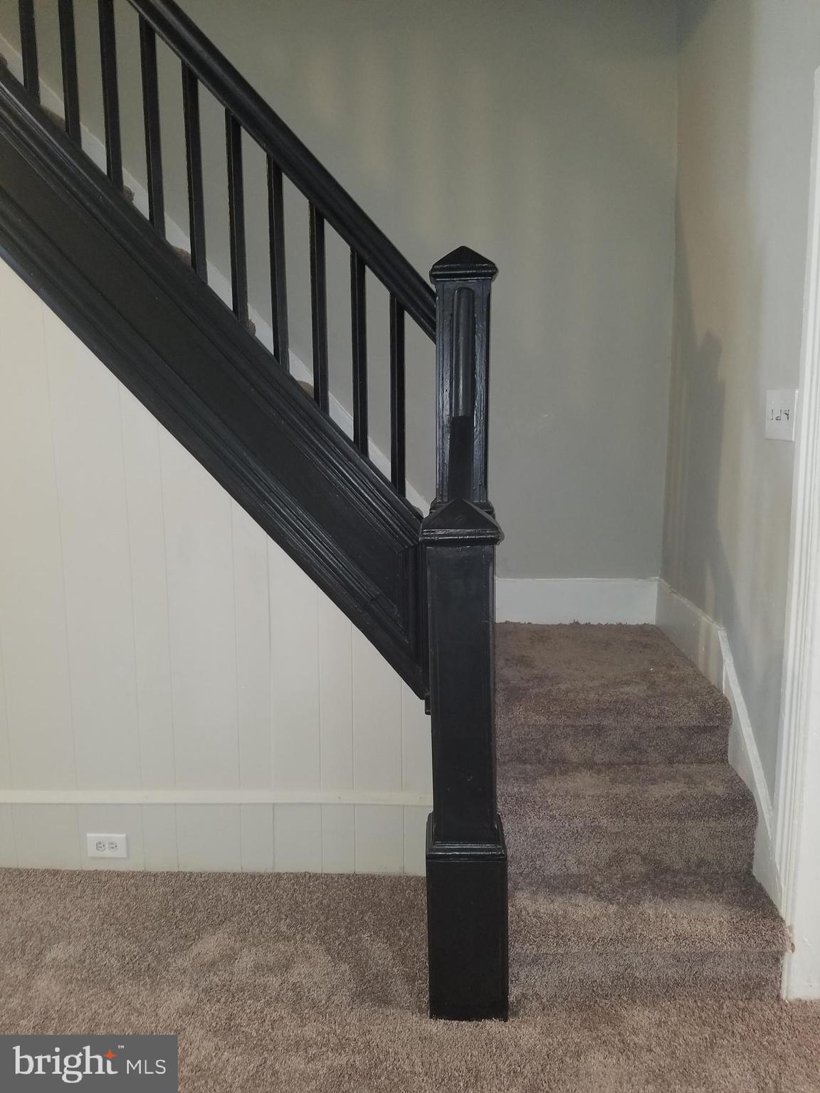 917 Robeson Street Reading, PA 19604 - Photo 9 of 18 Living room stairs