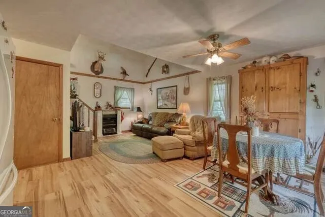a view of living room with furniture and a fireplace