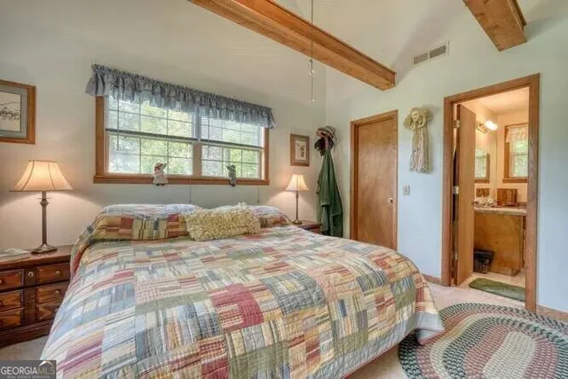 a view of a a dining room with furniture window and wooden floor