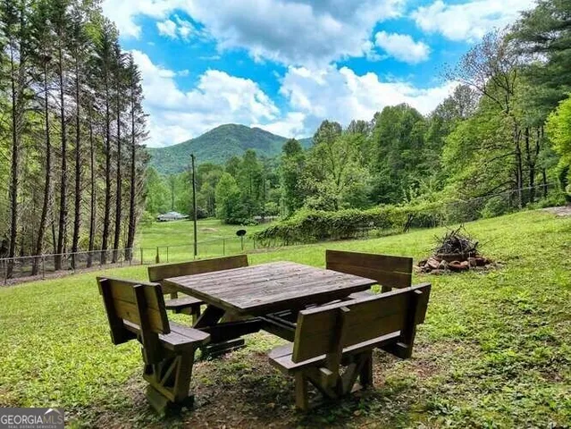 a house with trees in the background
