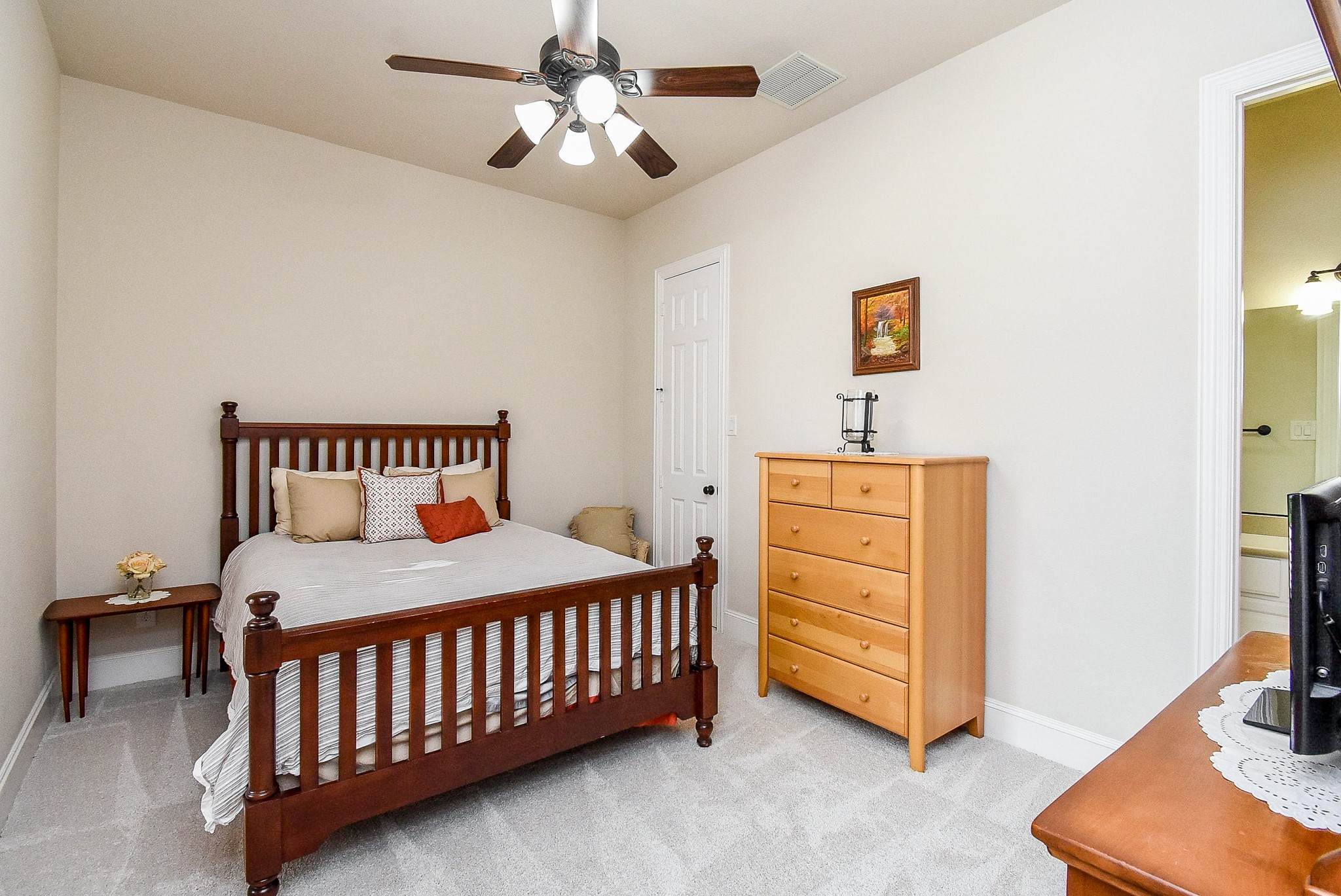 27427 Guthrie Ridge Lane Katy, TX 77494 - Photo 35 of 48 a bedroom with a bed and a chandelier