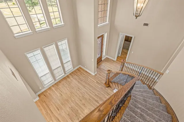 a view of living room and wooden floor