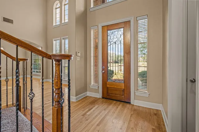 a view of front door with wooden floor