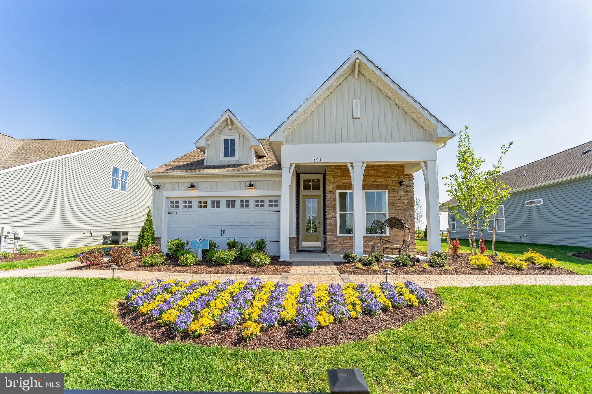 126 Merlin Drive Stevensville, MD 21666 - Photo 1 of 54 a front view of the house with outdoor space