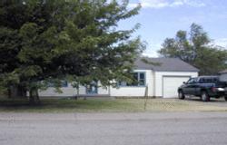 4310 South Travis Street Amarillo, TX 79110 - Photo 1 of 1 a front view of a house with a yard