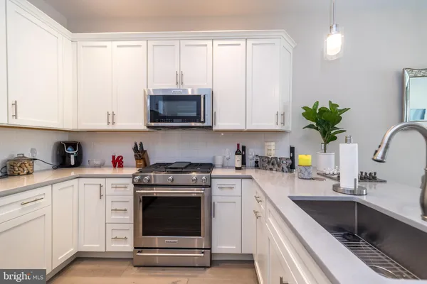 a kitchen with a refrigerator and cabinets