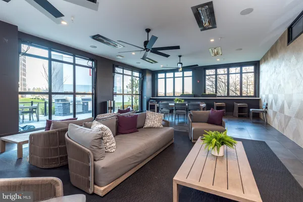 a room with pool table and windows