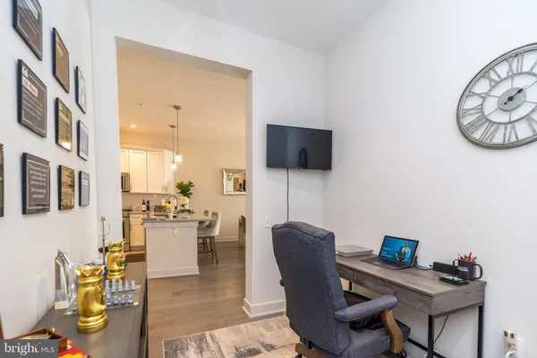 a view of a livingroom with furniture and a flat screen tv