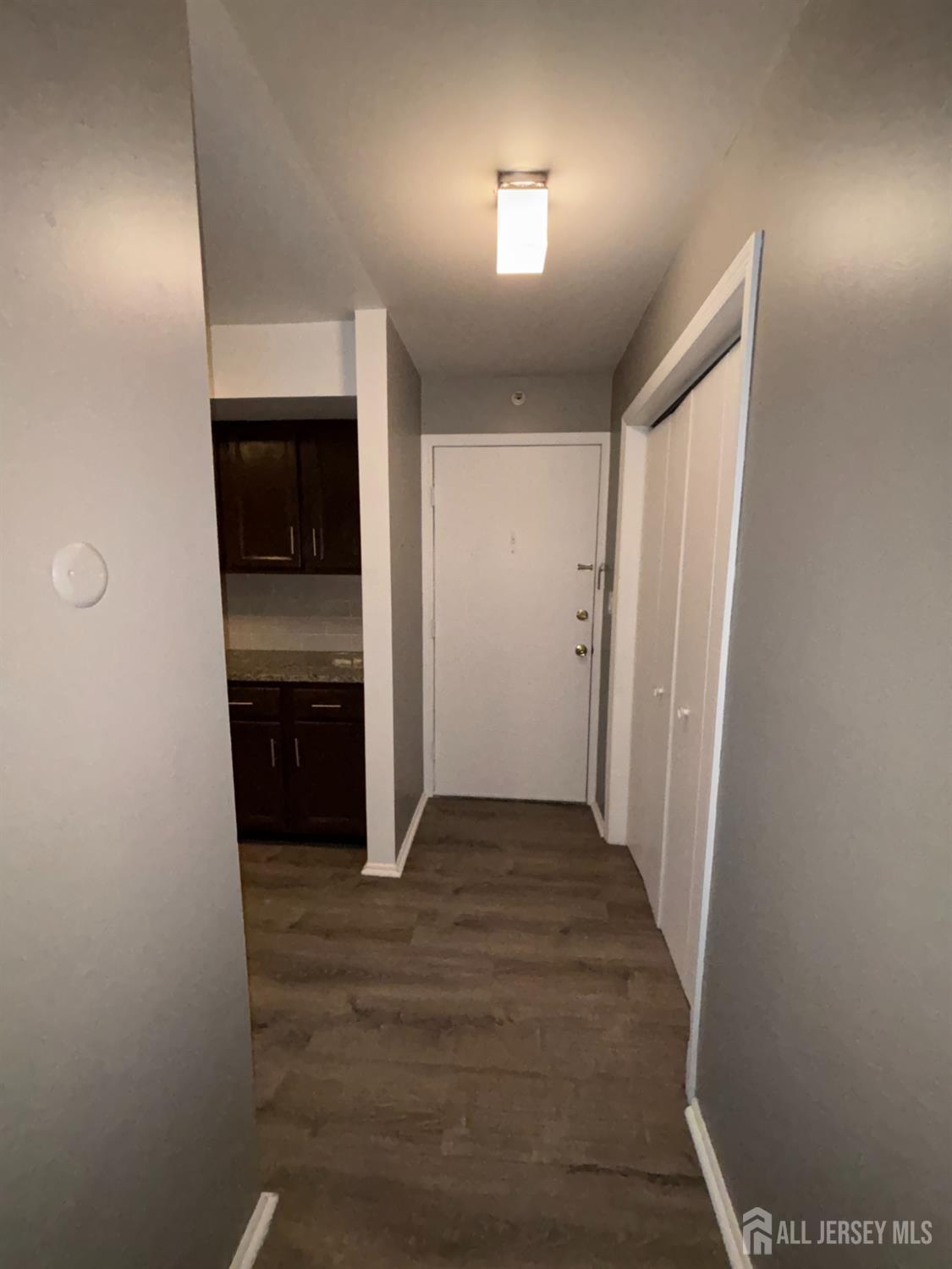 42 B Powderhorn Court, Unit 42B Woodbridge, NJ 07095 - Photo 5 of 14 a view of a hallway to rooms