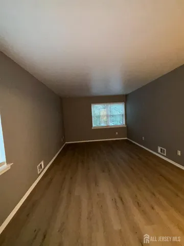 wooden floor and window in an empty room