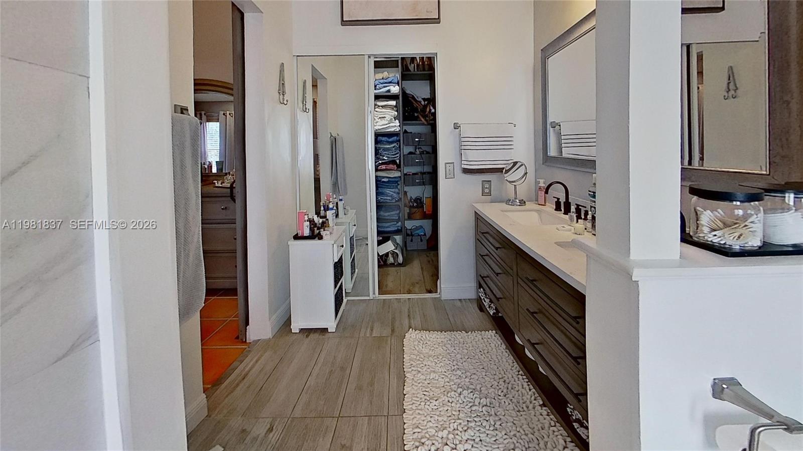 3760 Westminster Street Hollywood, FL 33021 - Photo 16 of 42 a kitchen with stainless steel appliances granite countertop a refrigerator and a wooden floor
