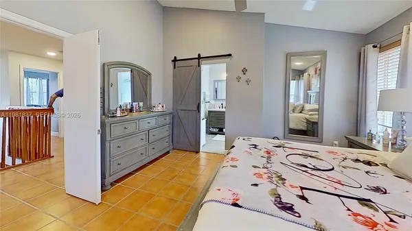 a en suite bathroom with a sink double vanity and a mirror