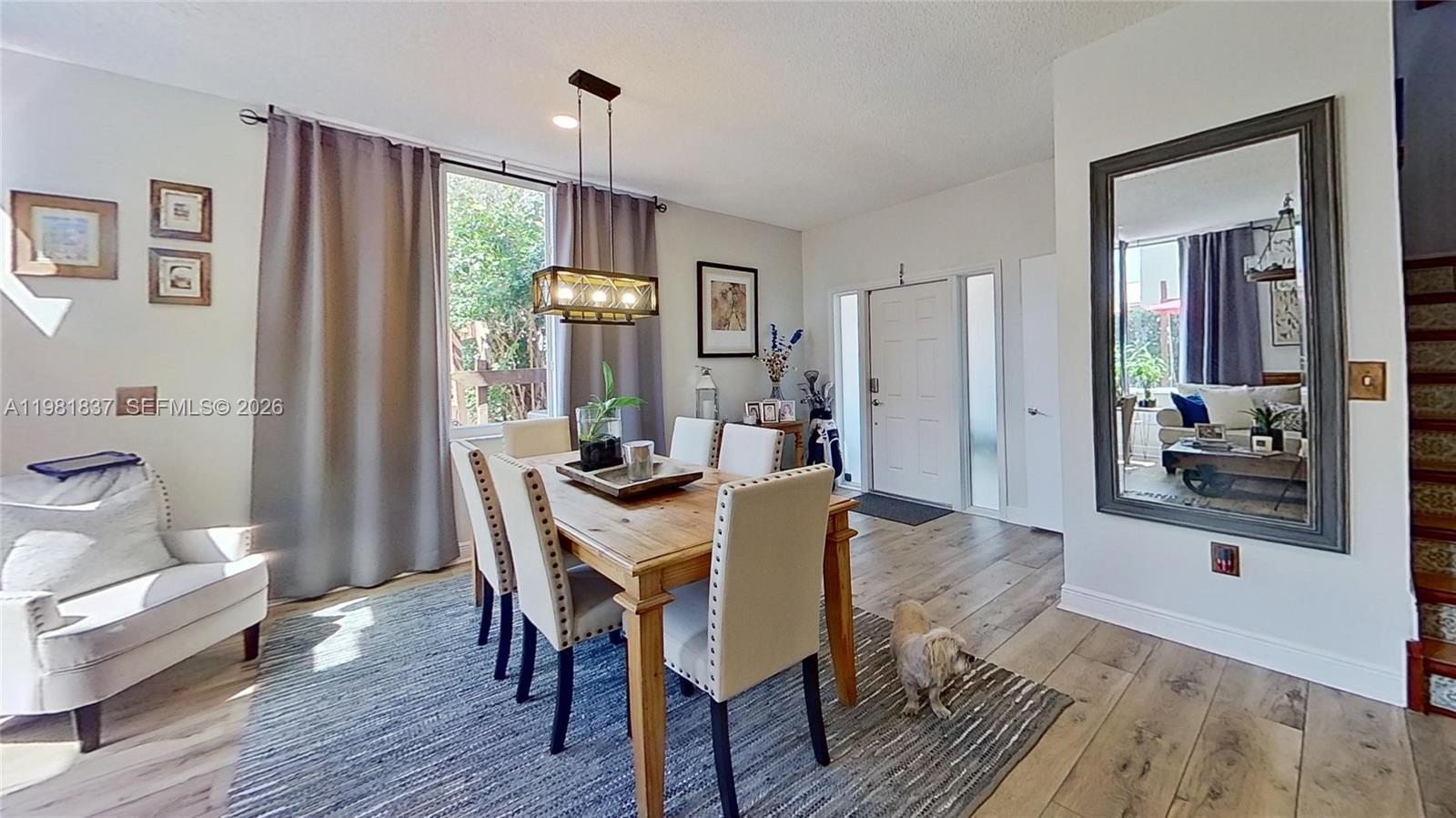 3760 Westminster Street Hollywood, FL 33021 - Photo 3 of 42 a view of a dining room with furniture window and wooden floor