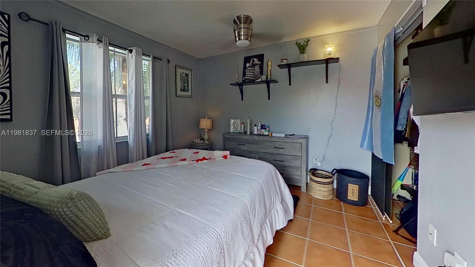 3760 Westminster Street Hollywood, FL 33021 - Photo 33 of 42 a bedroom with a bed and a window