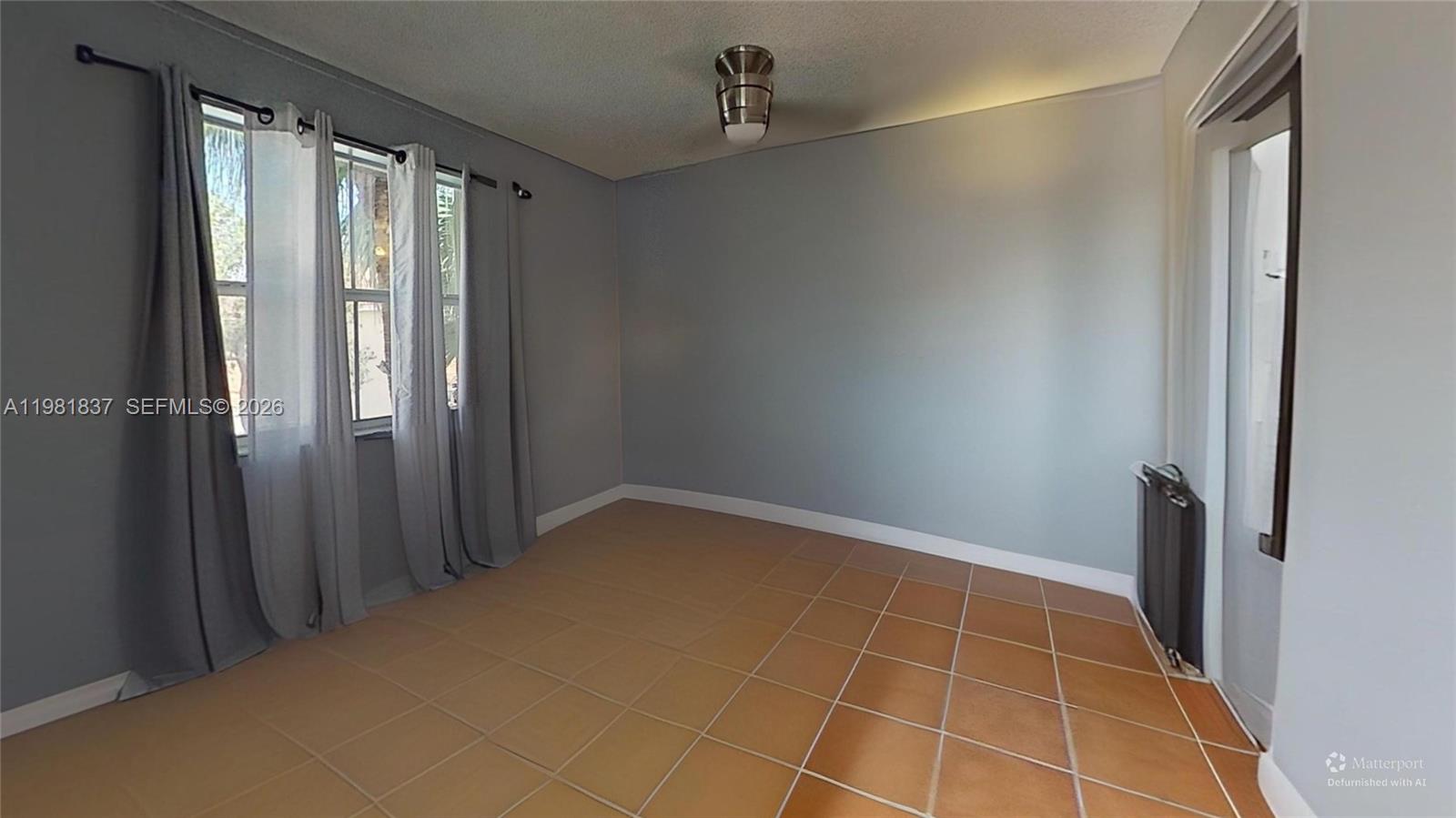 3760 Westminster Street Hollywood, FL 33021 - Photo 35 of 42 a view of an empty room with a window