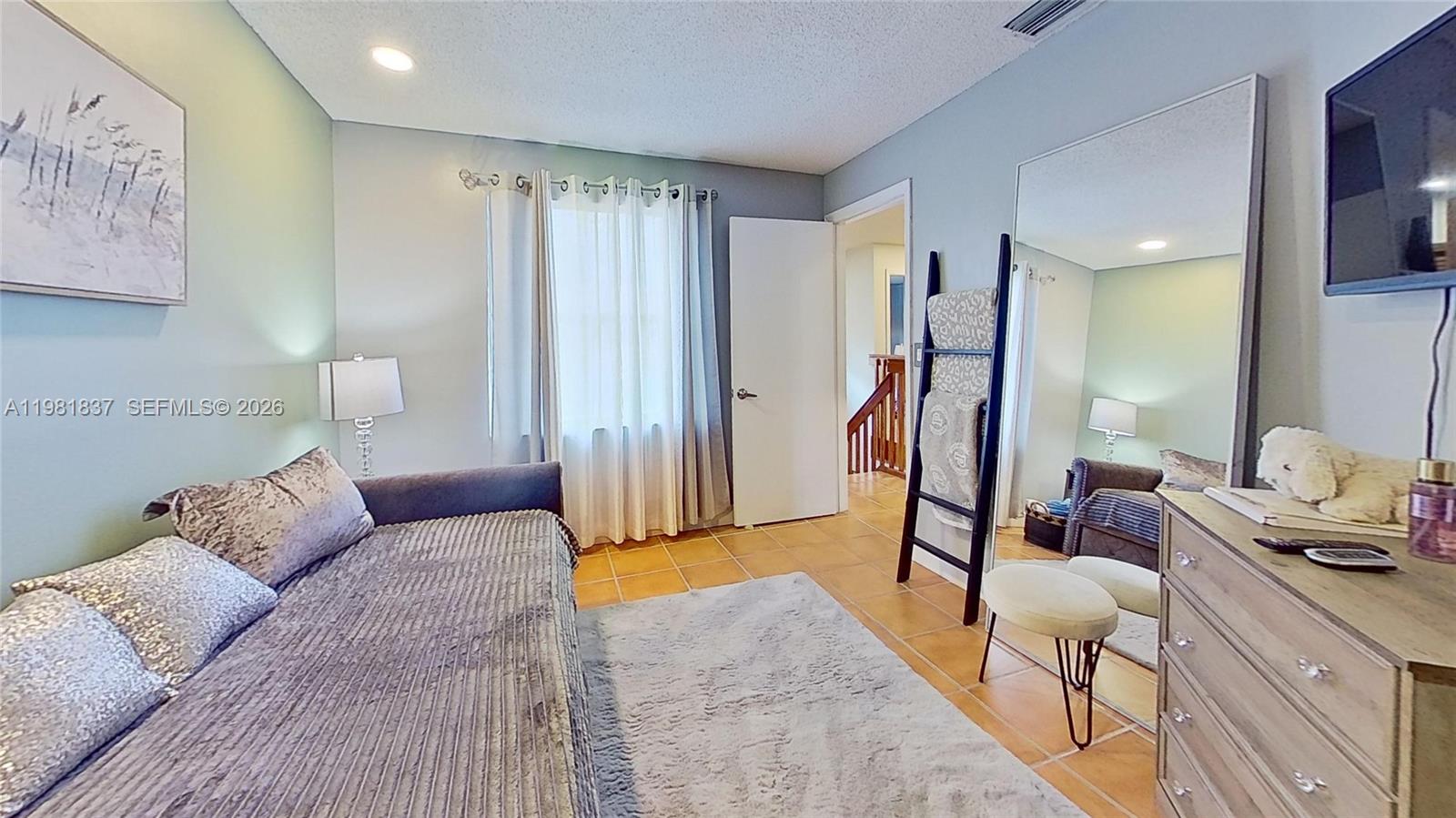 3760 Westminster Street Hollywood, FL 33021 - Photo 36 of 42 a living room with furniture and a window