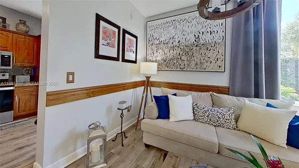 a living room with furniture and a window