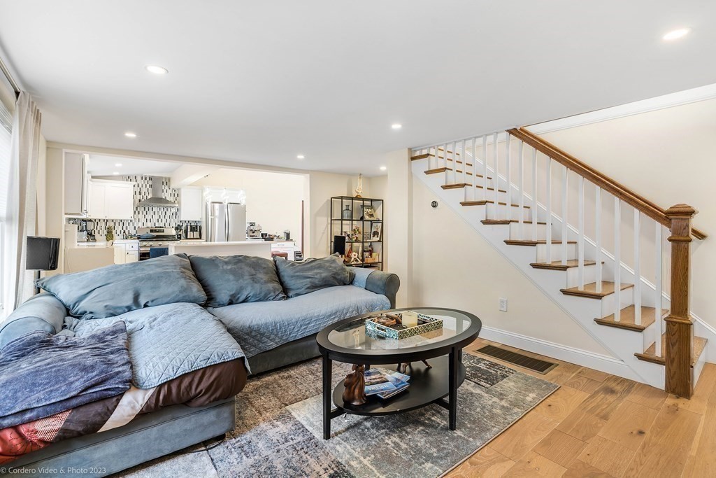 26 Mill Street Maynard, MA 01754 - Photo 18 of 29 a living room with furniture and wooden floor