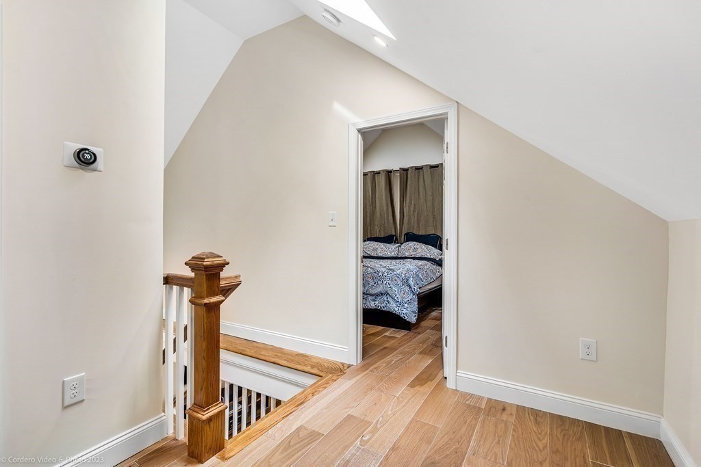 26 Mill Street Maynard, MA 01754 - Photo 22 of 29 a view of a hallway view with wooden floor and staircase