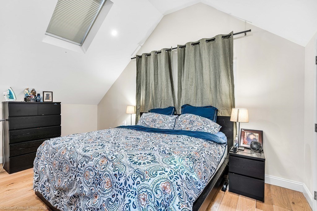 26 Mill Street Maynard, MA 01754 - Photo 23 of 29 a bedroom with a bed and a cabinet