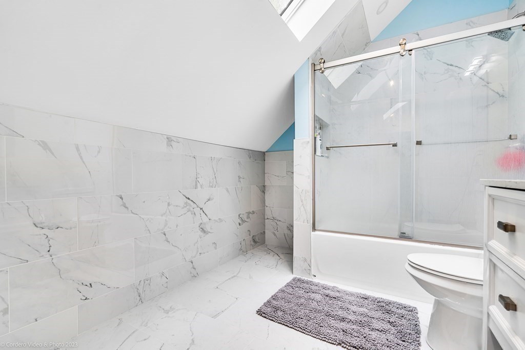 26 Mill Street Maynard, MA 01754 - Photo 27 of 29 a bathroom with a shower and a toilet