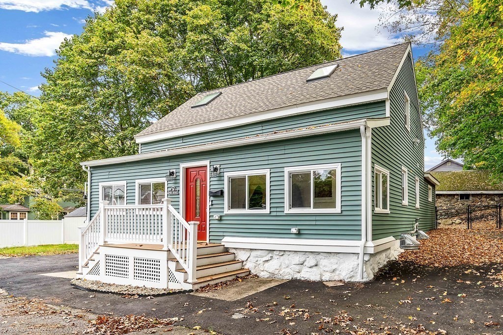 26 Mill Street Maynard, MA 01754 - Photo 3 of 29 a view of a house with a yard and large tree